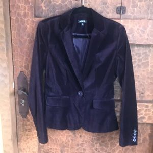 Purple velvet jacket.  6 Apartment 9